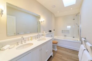 White double sink in luxury bathroom